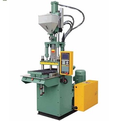 VERTICAL INJECTION MOULDING MACHINE